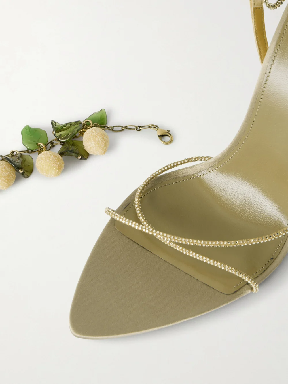 Close-up detail of the Saint Laurent Mon Chéri Embellished Suede-trimmed Satin Sandals