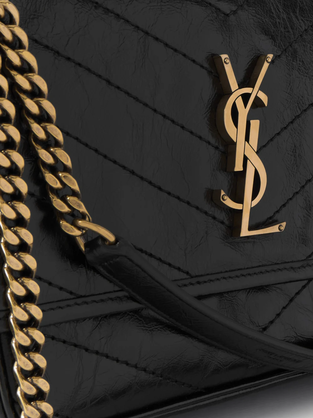 Close-up detail of the Saint Laurent Niki Medium Cassandre-embellished Crinkled-leather Shoulder Bag