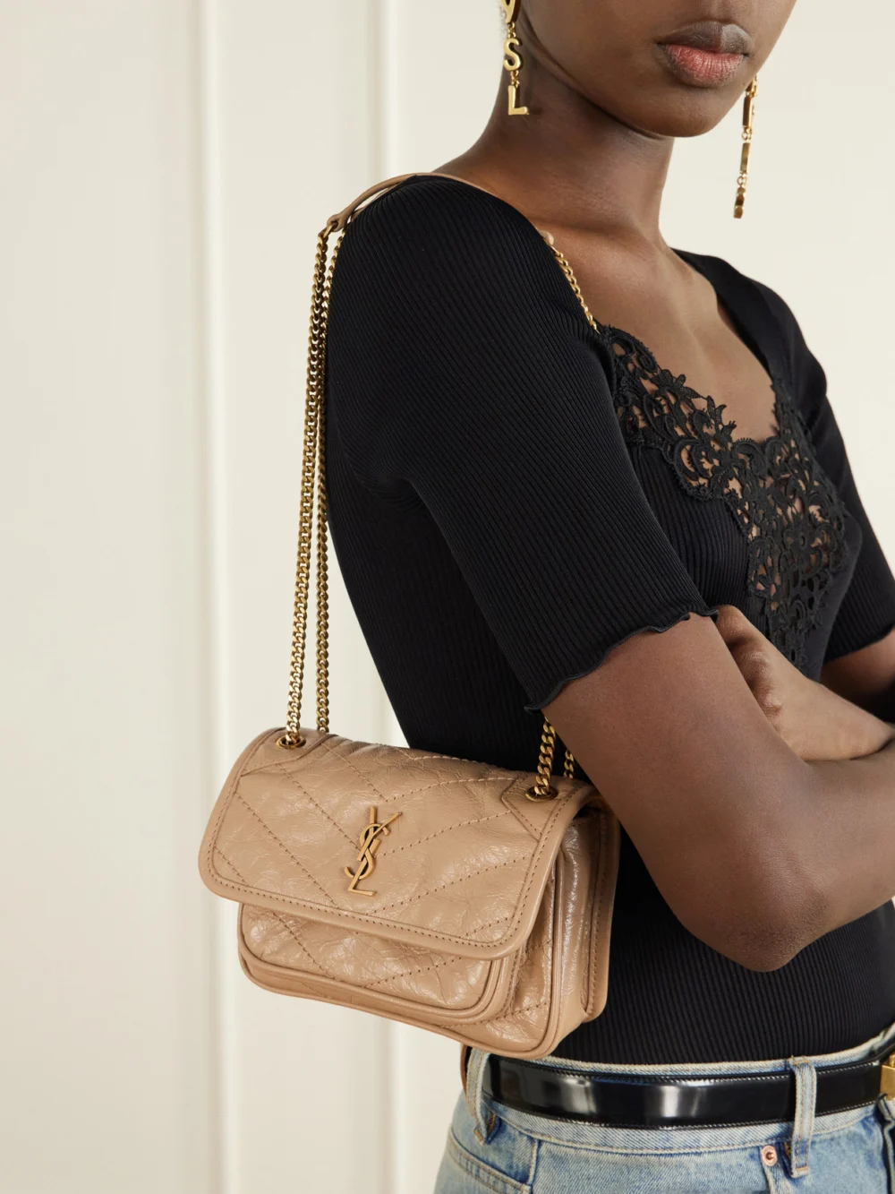 Saint Laurent Niki Mini Cassandre-embellished Crinkled-leather Shoulder Bag, styled view