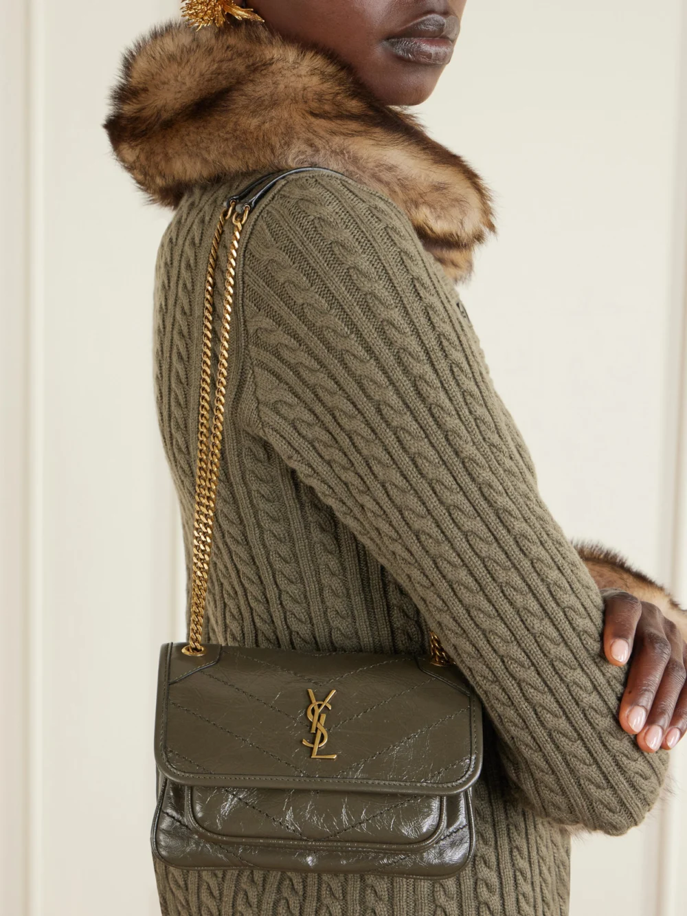 Saint Laurent Niki Mini Cassandre-embellished Crinkled-leather Shoulder Bag, styled view