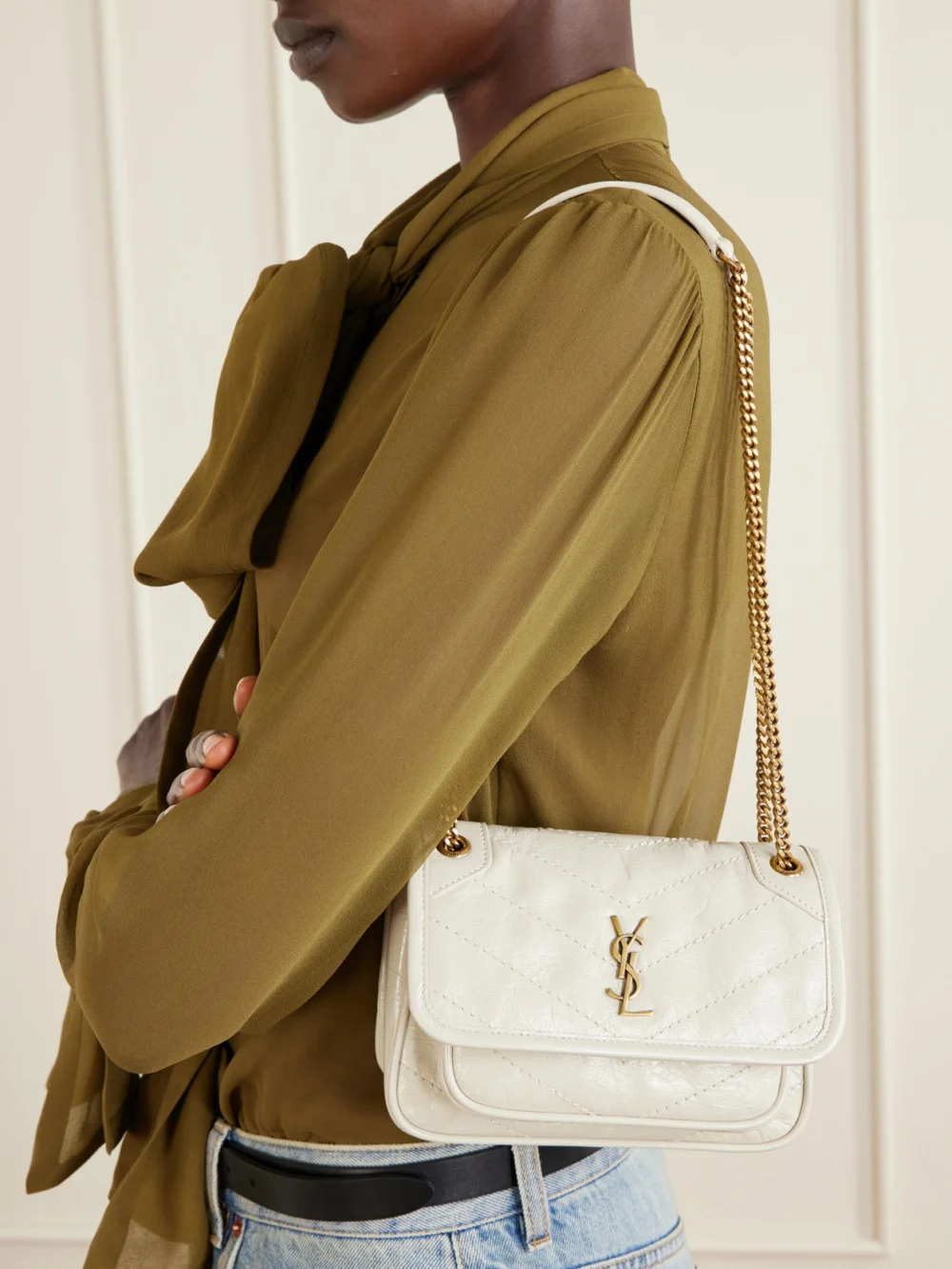 Saint Laurent Niki Mini Cassandre-embellished Crinkled-leather Shoulder Bag, styled view