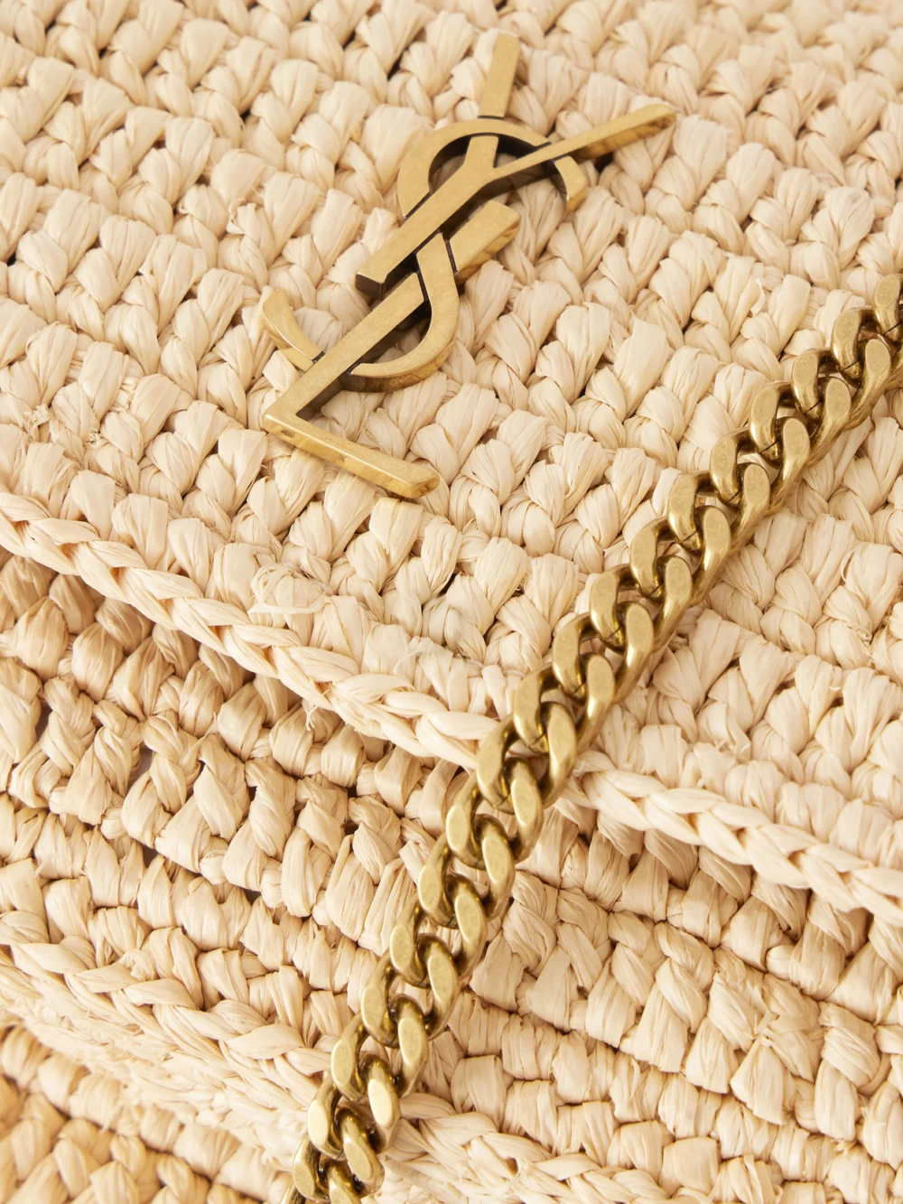 Close-up detail of the Saint Laurent Niki Mini Leather-trimmed Raffia Shoulder Bag