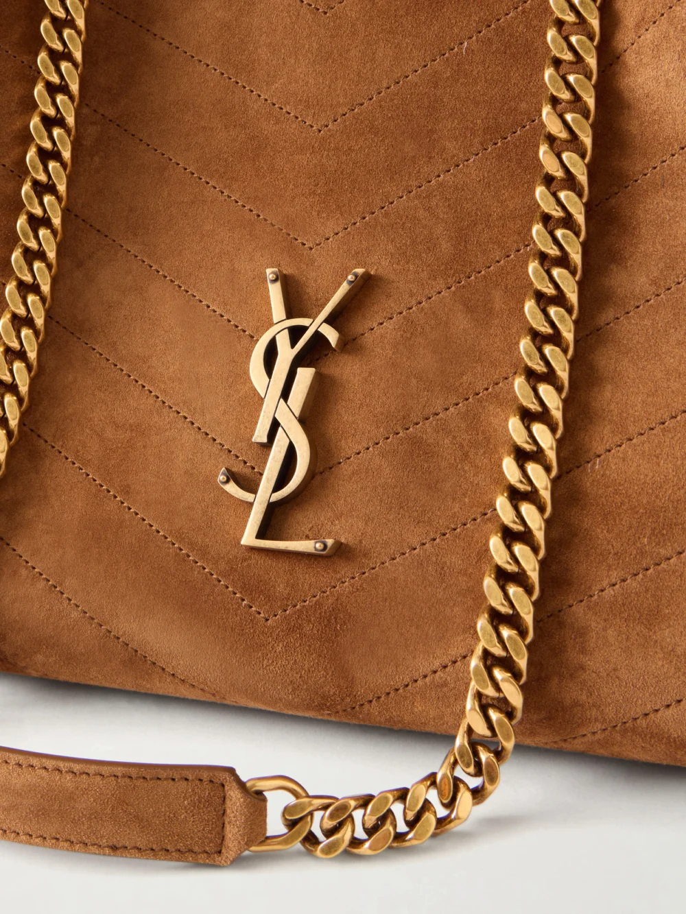 Close-up detail of the Saint Laurent Niki Shopper Quilted Suede Shoulder Bag