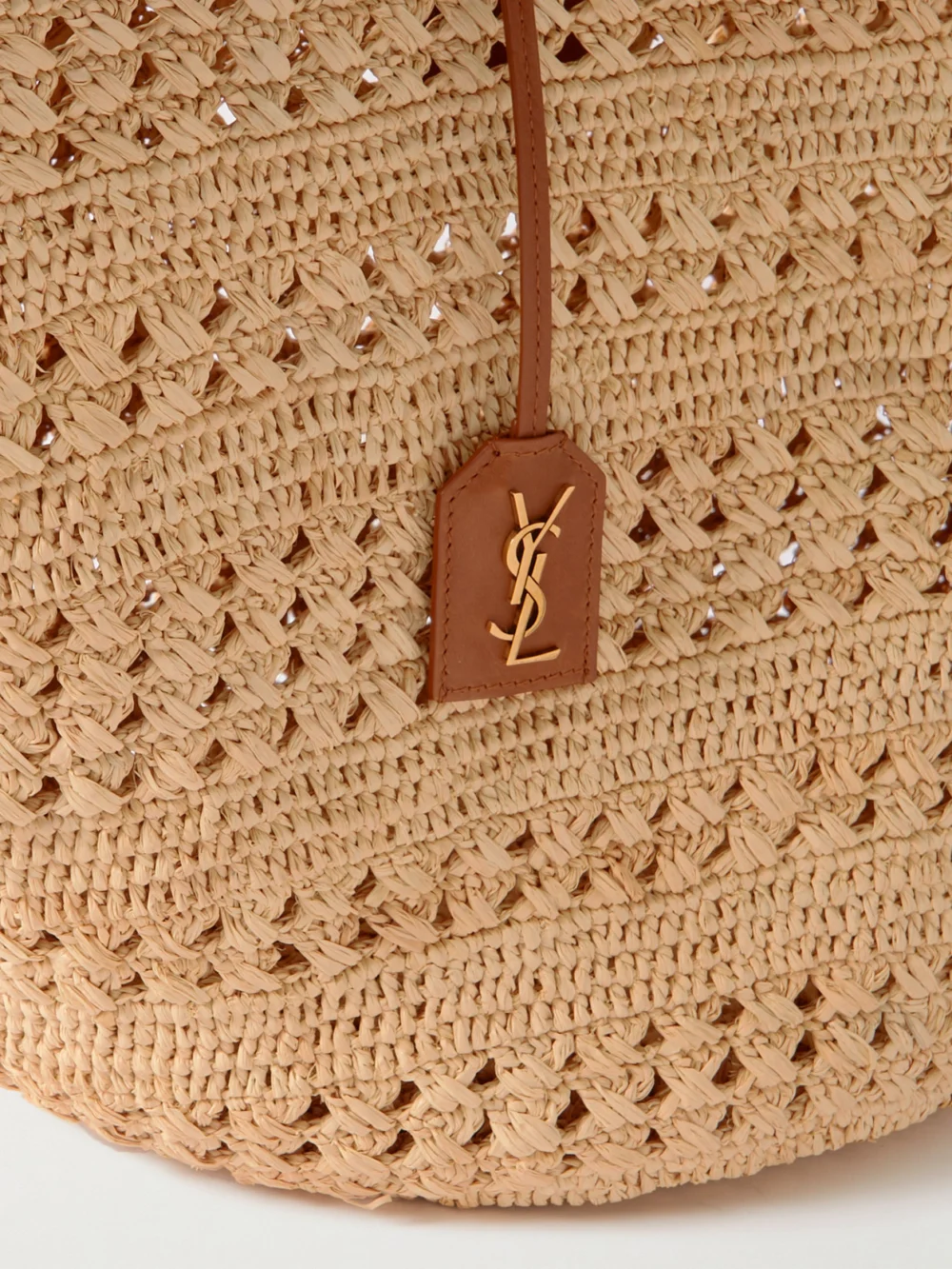 Close-up detail of the Saint Laurent Panier Medium Leather-trimmed Raffia Tote