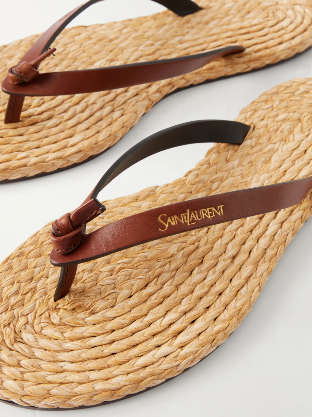 Close-up detail of the Saint Laurent Pool Knotted Leather Flip Flops