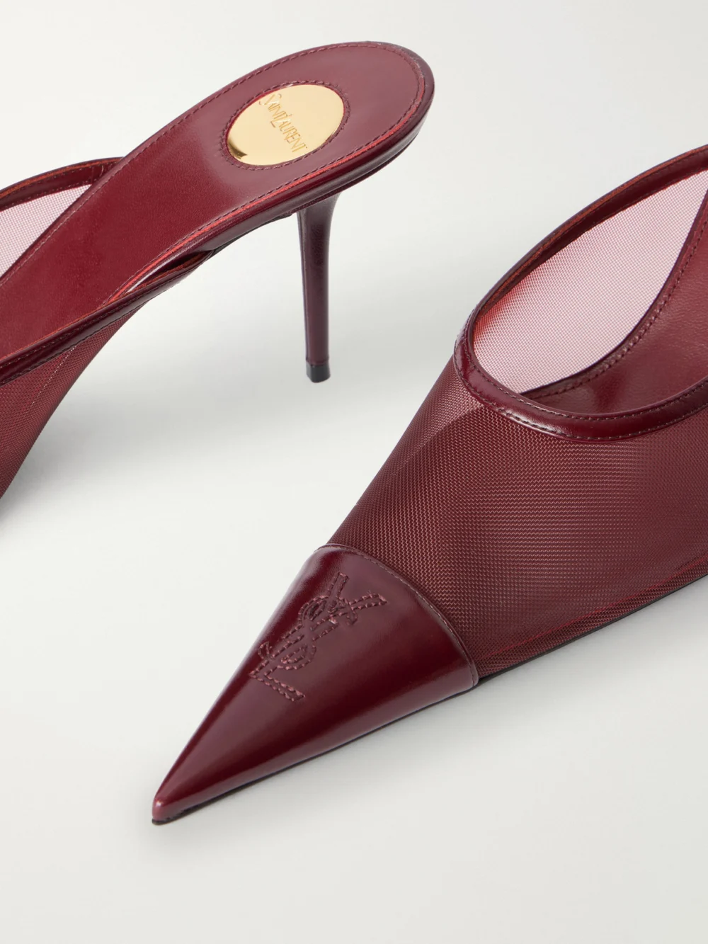 Close-up detail of the Saint Laurent Renée 75 Cassandre-embroidered Leather-trimmed Mesh Pumps