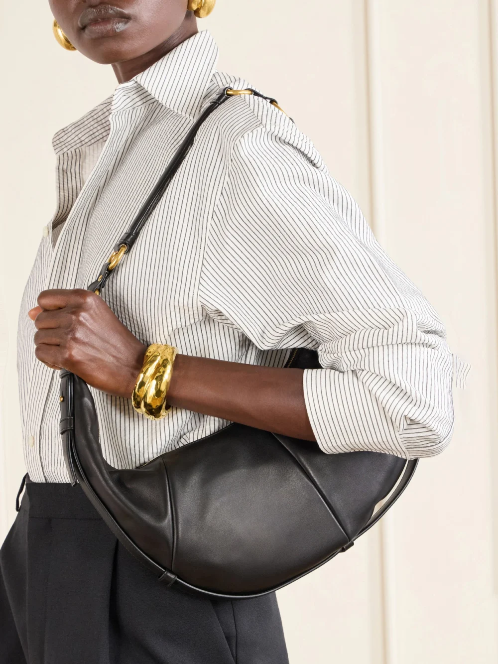 Saint Laurent Saharienne Leather Shoulder Bag, styled view