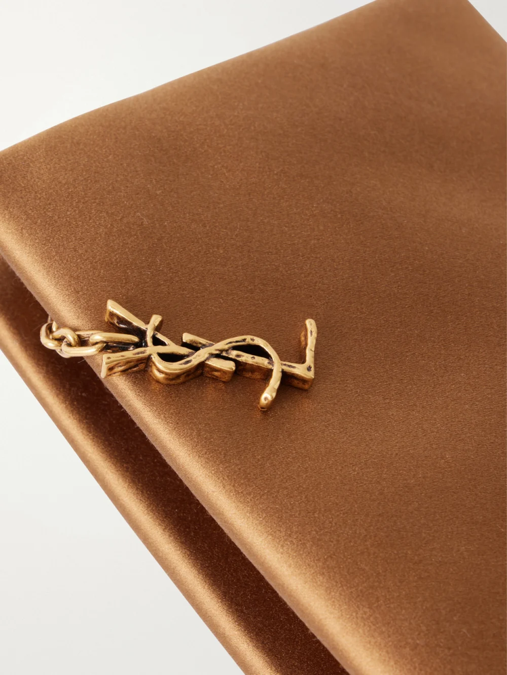 Close-up detail of the Saint Laurent Satin Clutch