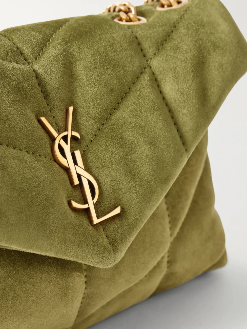 Close-up detail of the Saint Laurent Toy Puffer Matelassé Leather-trimmed Suede Shoulder Bag