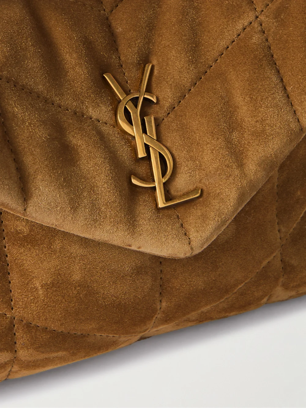 Close-up detail of the Saint Laurent Toy Puffer Matelassé Leather-trimmed Suede Shoulder Bag