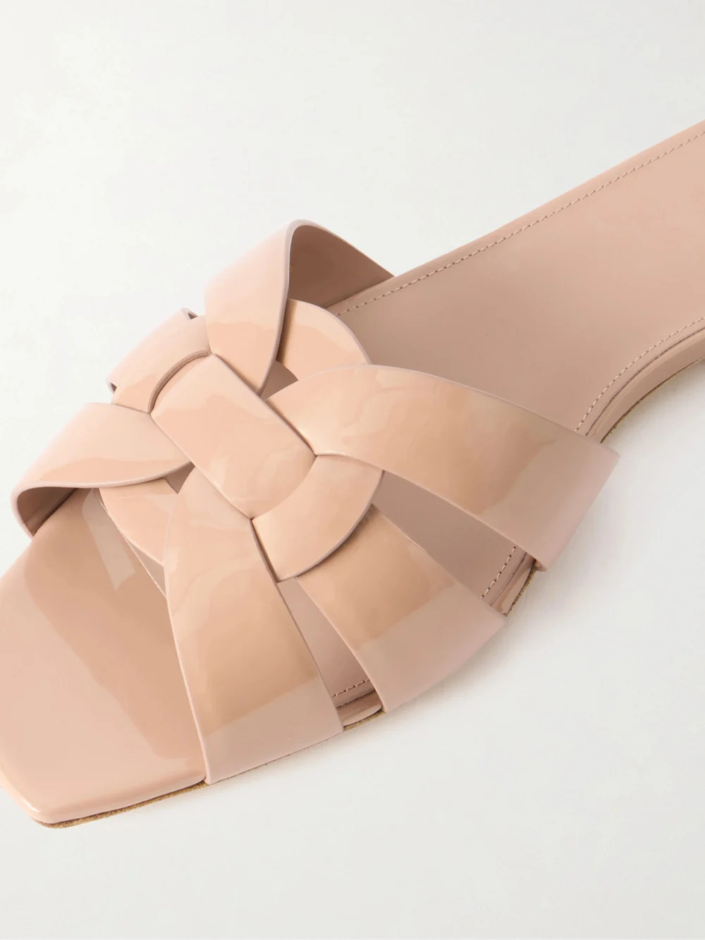 Close-up detail of the Saint Laurent Tribute Woven Patent-leather Slides