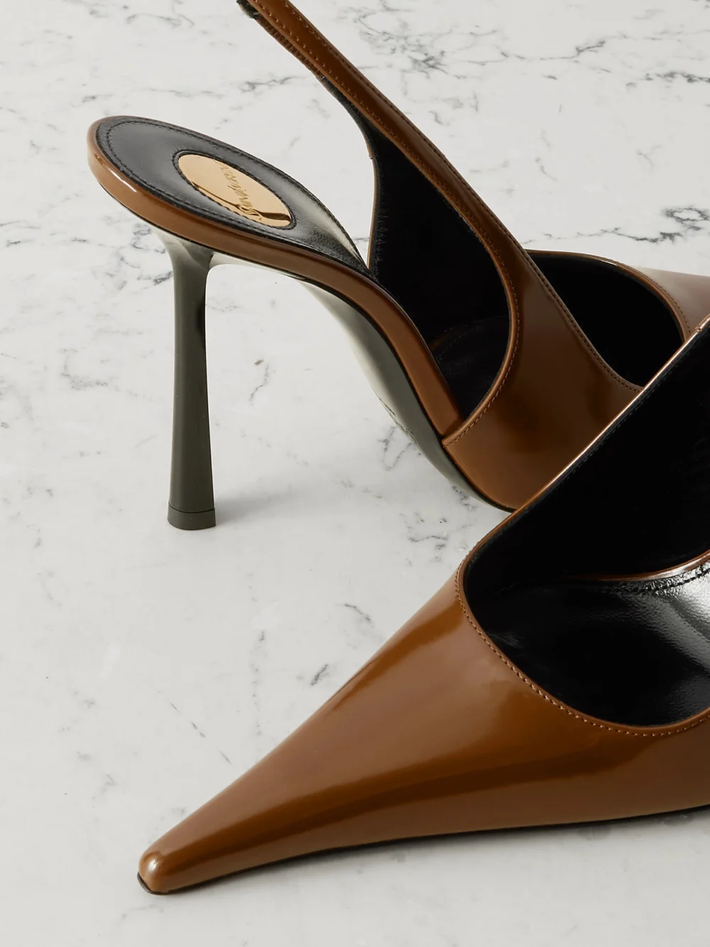 Close-up detail of the Saint Laurent Vendôme Glossed-leather Slingback Pumps