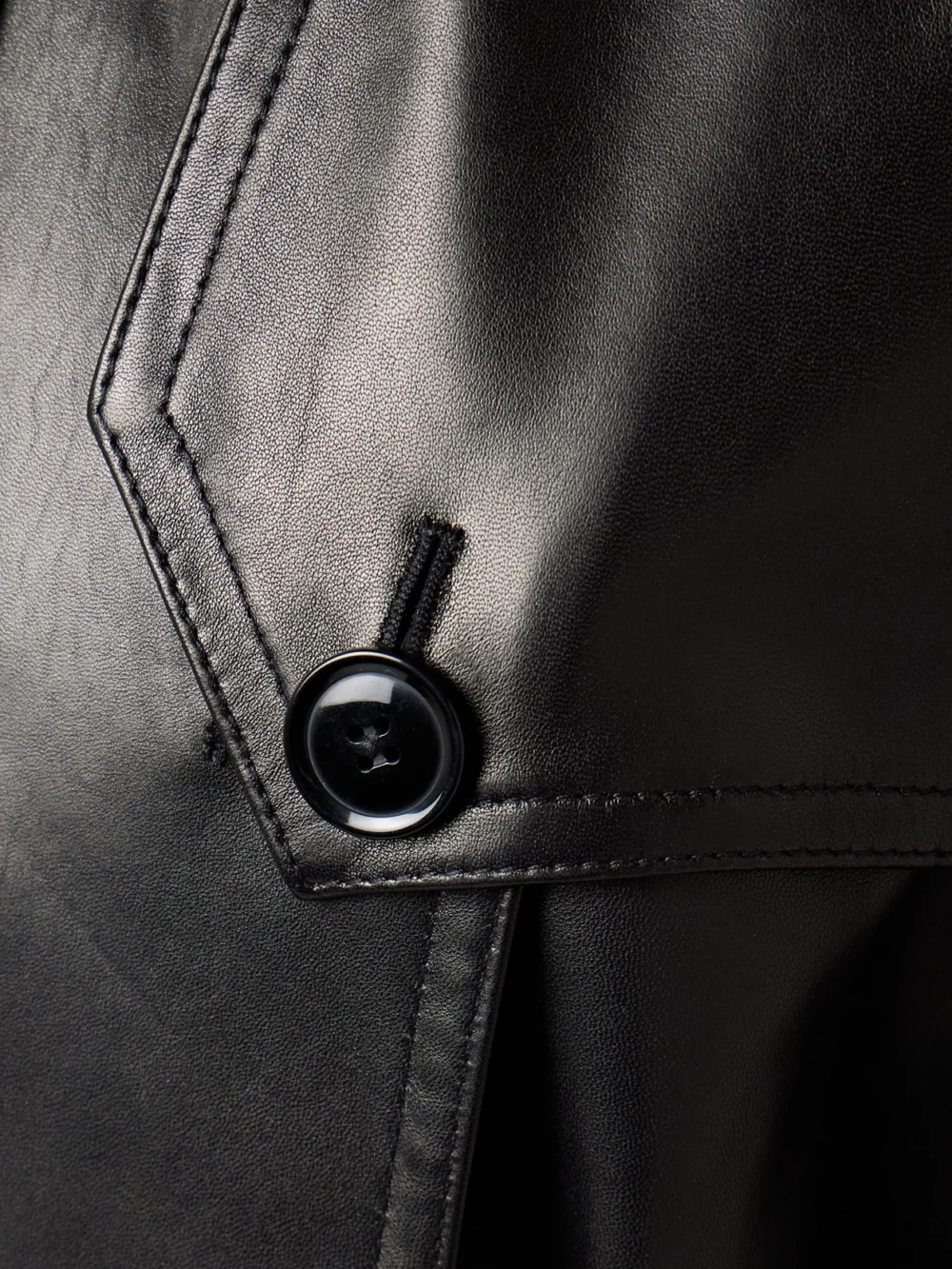 Close-up detail of the Salon 1884 Filippa Double-breasted Belted Leather Trench Coat