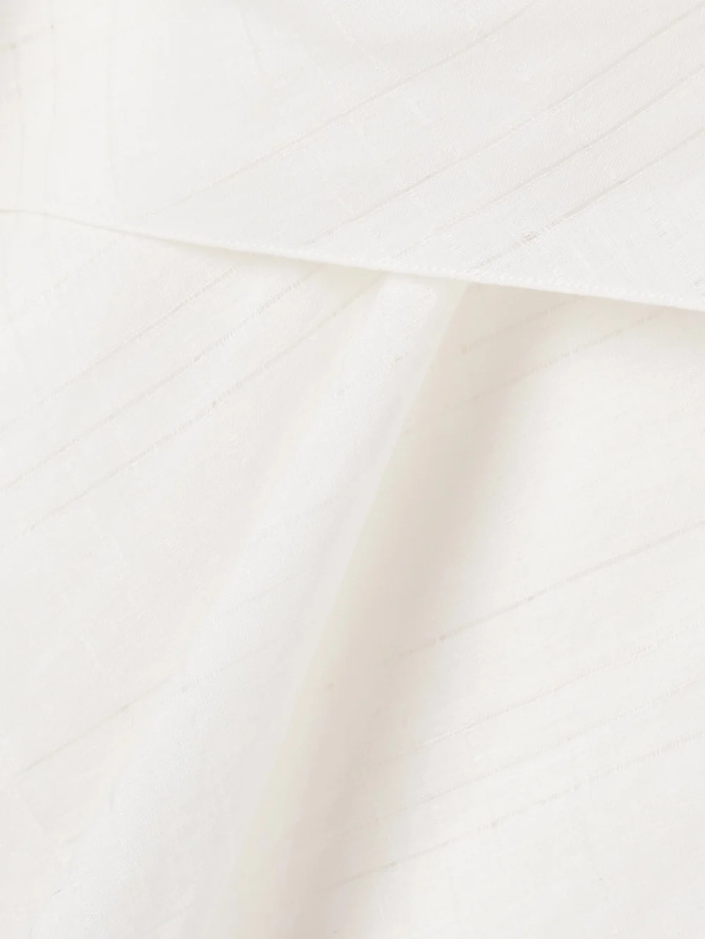 Close-up detail of the Salon 1884 Mira Draped Layered Linen Top