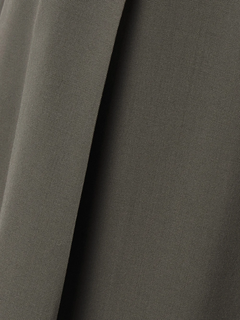 Close-up detail of the Salon 1884 Odile Pleated Wool Wide-leg Pants