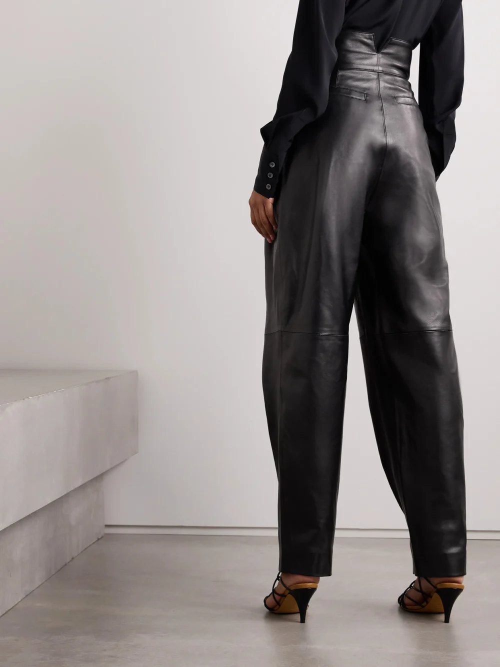 Back view of the Salon 1884 Rekian Pleated Leather Tapered Pants