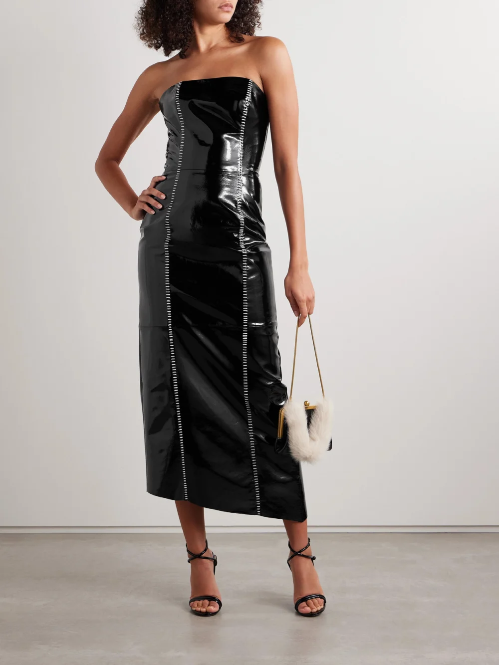 Salon 1884 Sioux Strapless Asymmetric Whipstitched Patent-leather Dress, worn by a model