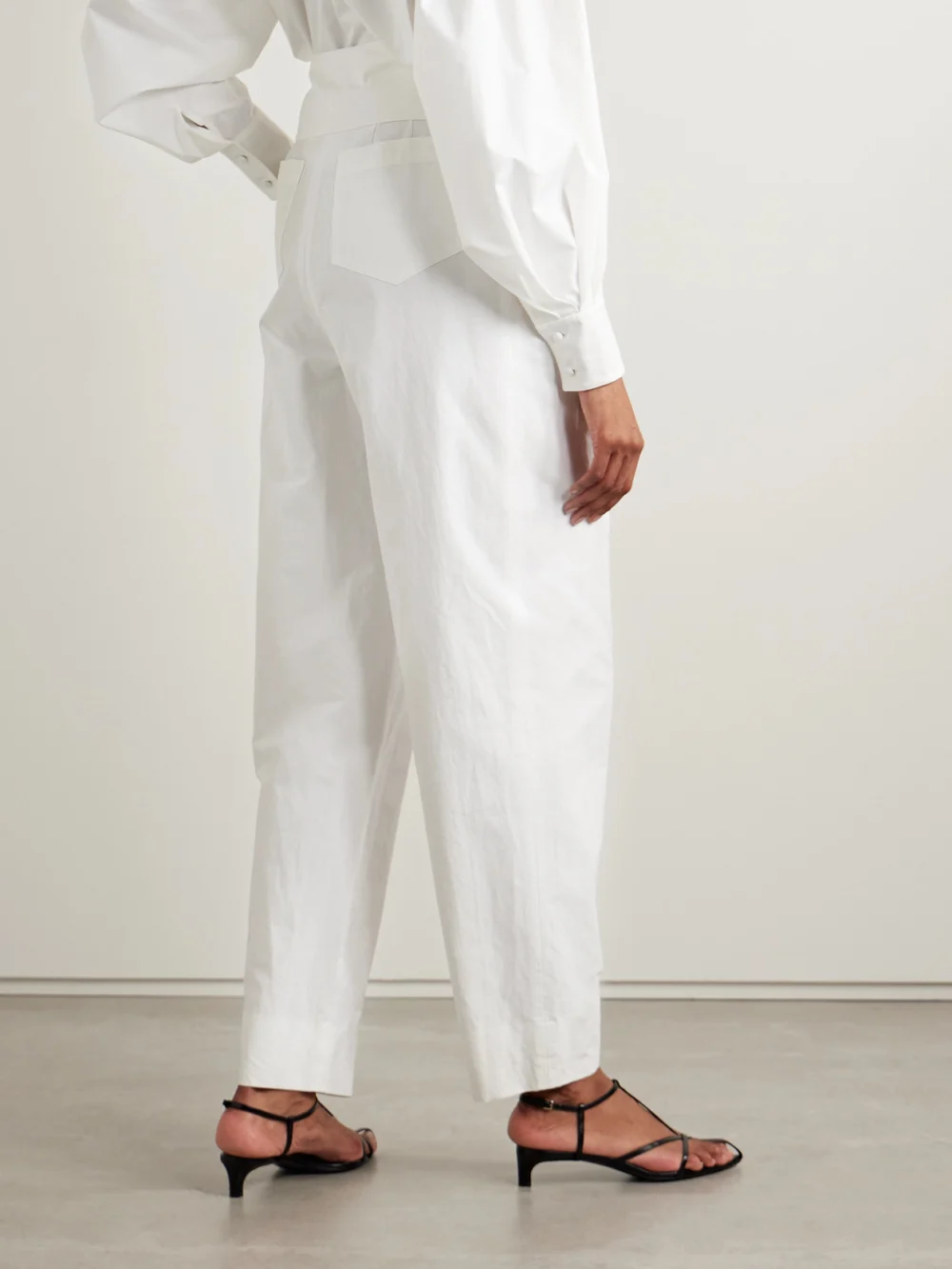 Back view of the Salon 1884 Soren Layered Pleated Cotton-blend Poplin Tapered Pants