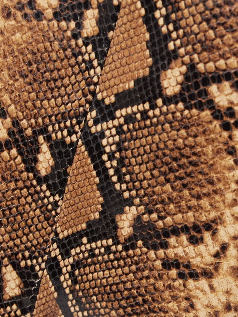 Close-up detail of the Salon 1884 Yvette Paneled Snake-effect Leather Skirt