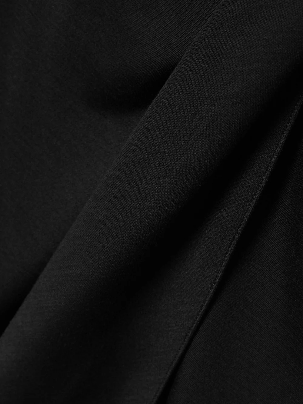 Close-up detail of the Salon 1884 Zadie Tie-detailed Draped Wool-jersey Midi Skirt
