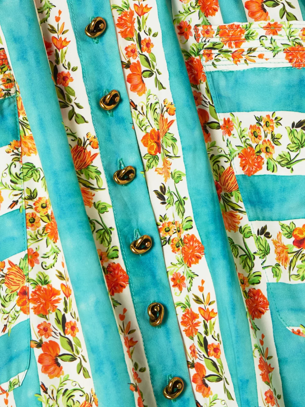 Close-up detail of the Saloni Kirat Belted Striped Floral-print Cotton-poplin Midi Skirt