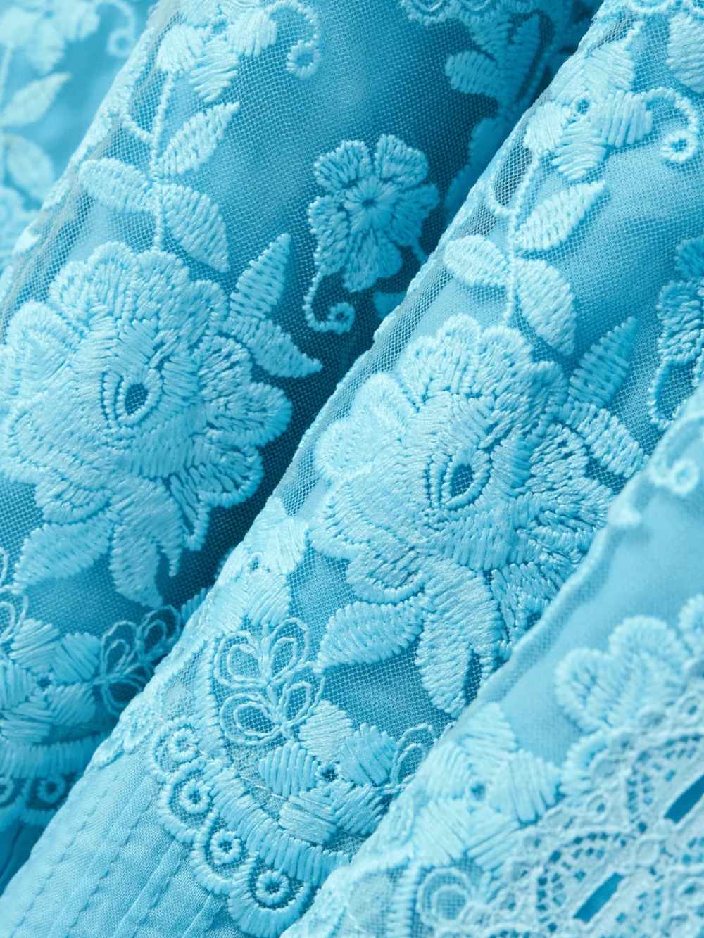 Close-up detail of the Saloni Lea Paneled Pintucked Lace and Cotton-voile Midi Dress