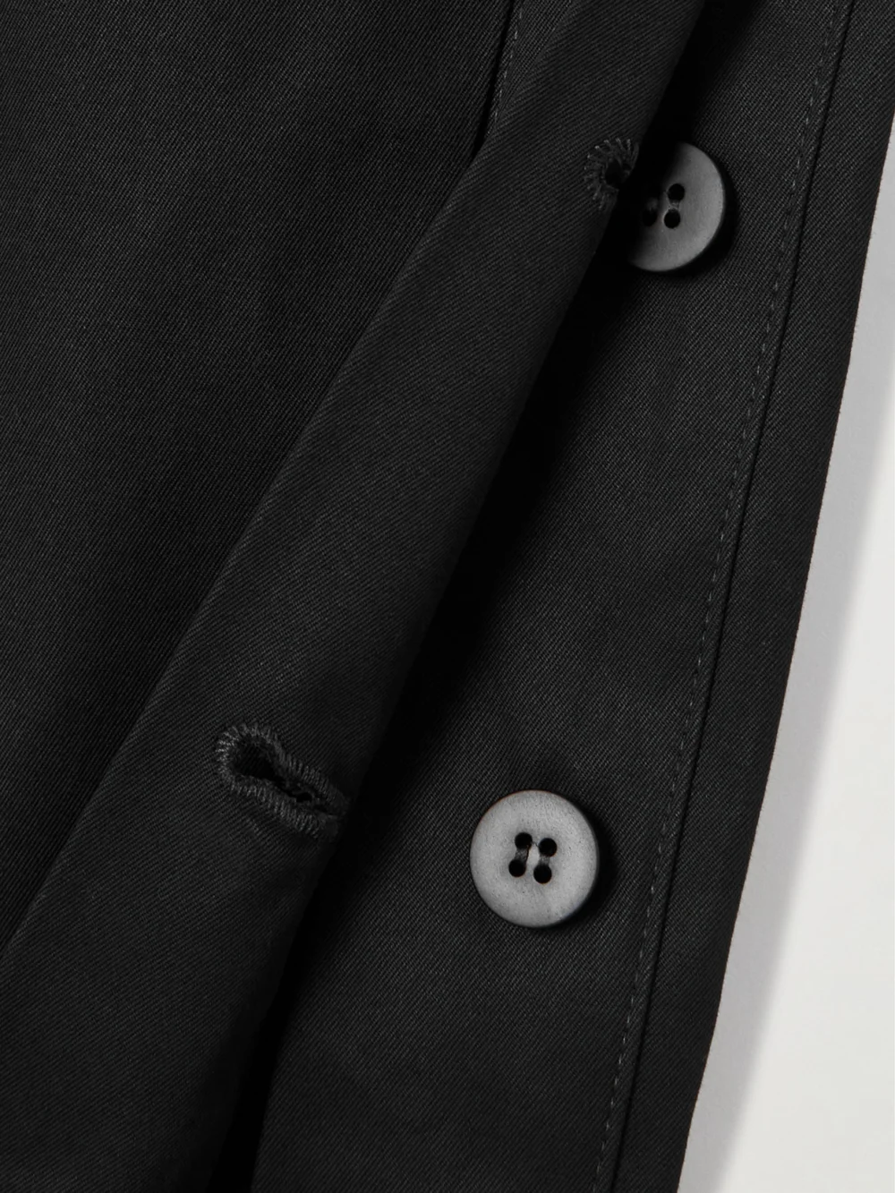 Close-up detail of the Sasuphi Elettra Belted Cotton-twill Mini Dress