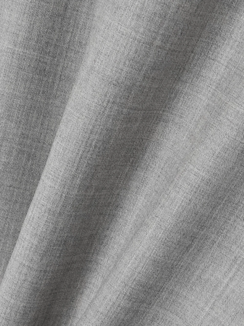 Close-up detail of the Sasuphi Lauren Frayed Wool Maxi Skirt