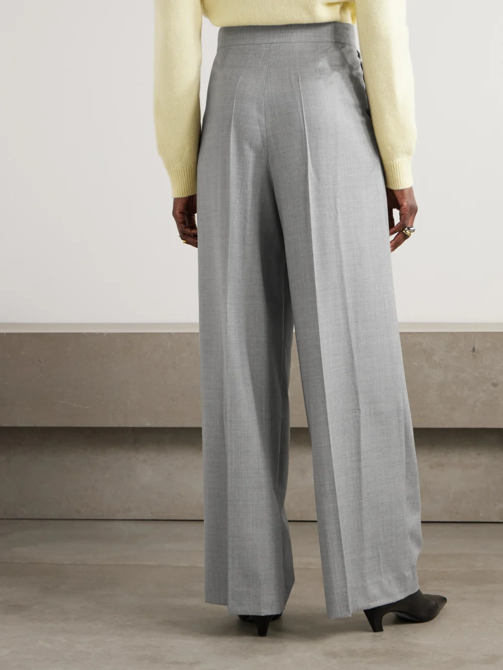 Back view of the Sasuphi Lauren Pleated Wool Wide-leg Pants