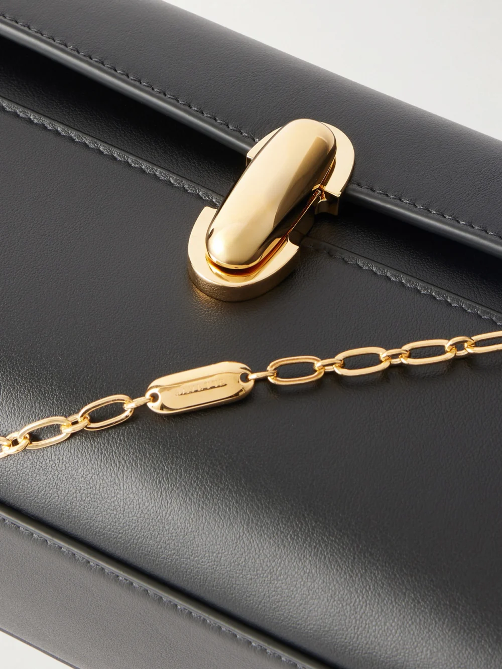 Close-up detail of the Savette Chain Symmetry Pochette Leather Shoulder Bag