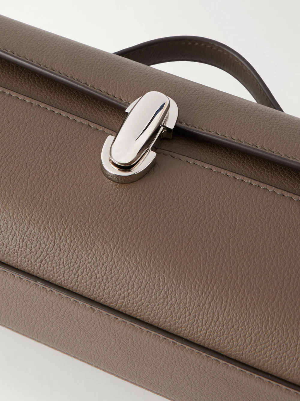 Close-up detail of the Savette Slim Symmetry Leather Clutch