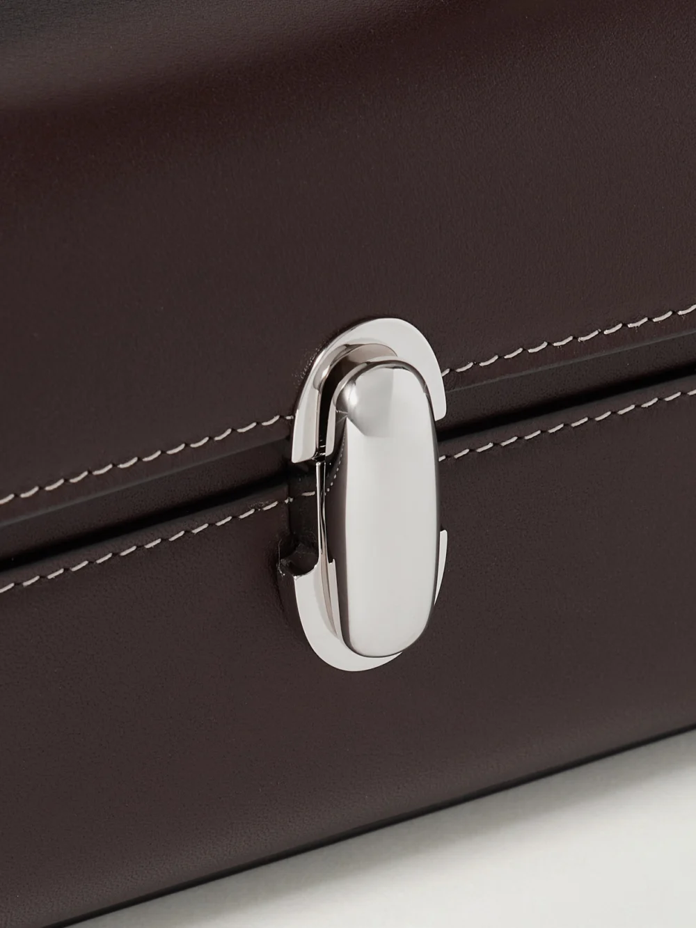 Close-up detail of the Savette Slim Symmetry Leather Top-handle Bag