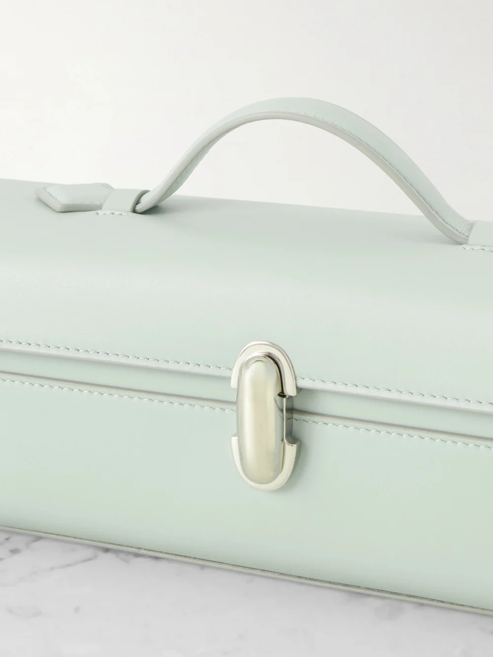 Close-up detail of the Savette Slim Symmetry Leather Top-handle Bag
