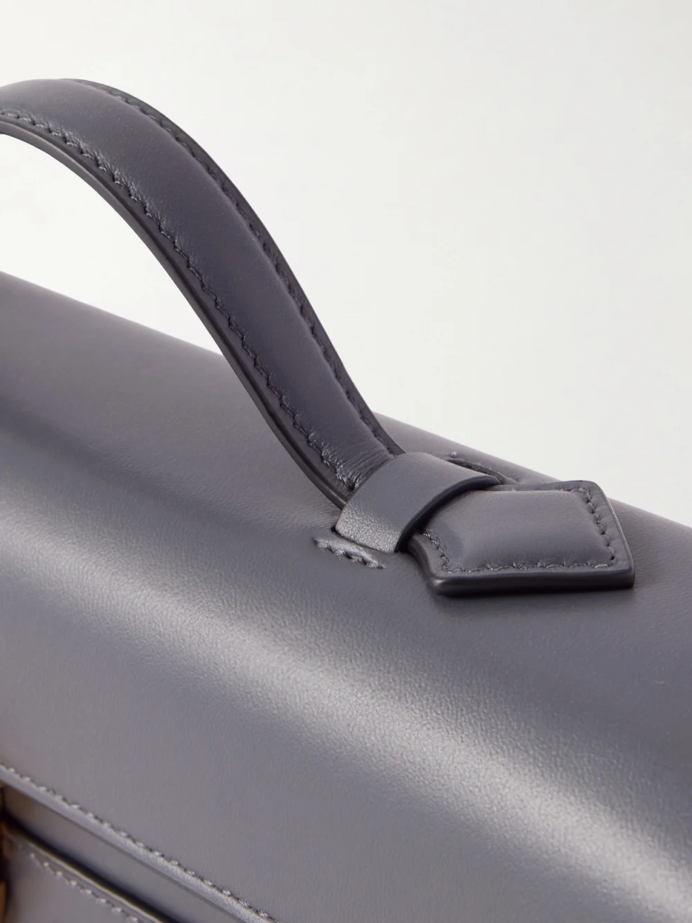 Close-up detail of the Savette Slim Symmetry Leather Top-handle Bag
