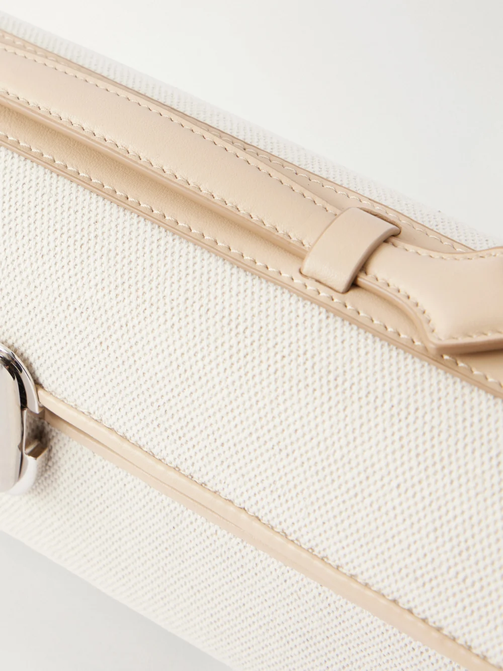Close-up detail of the Savette Slim Symmetry Leather-trimmed Canvas Top-handle Bag