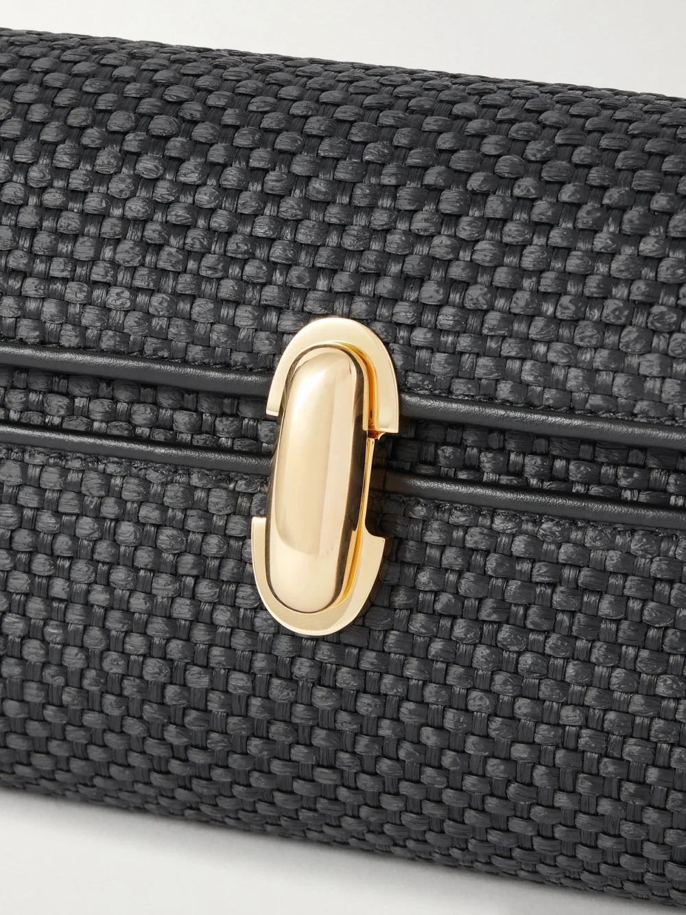 Close-up detail of the Savette Symmetry Leather-trimmed Woven Raffia Shoulder Bag