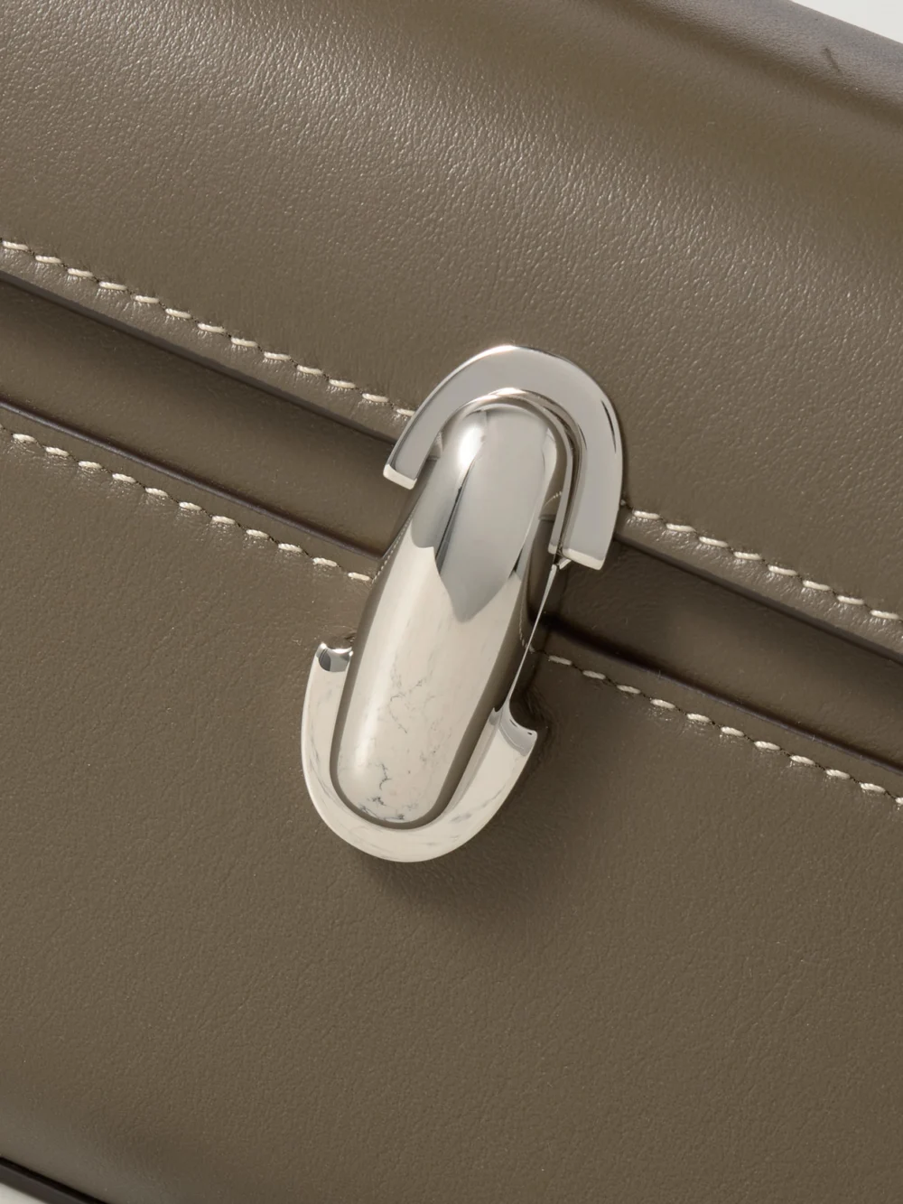 Close-up detail of the Savette Symmetry Pochette Leather Tote