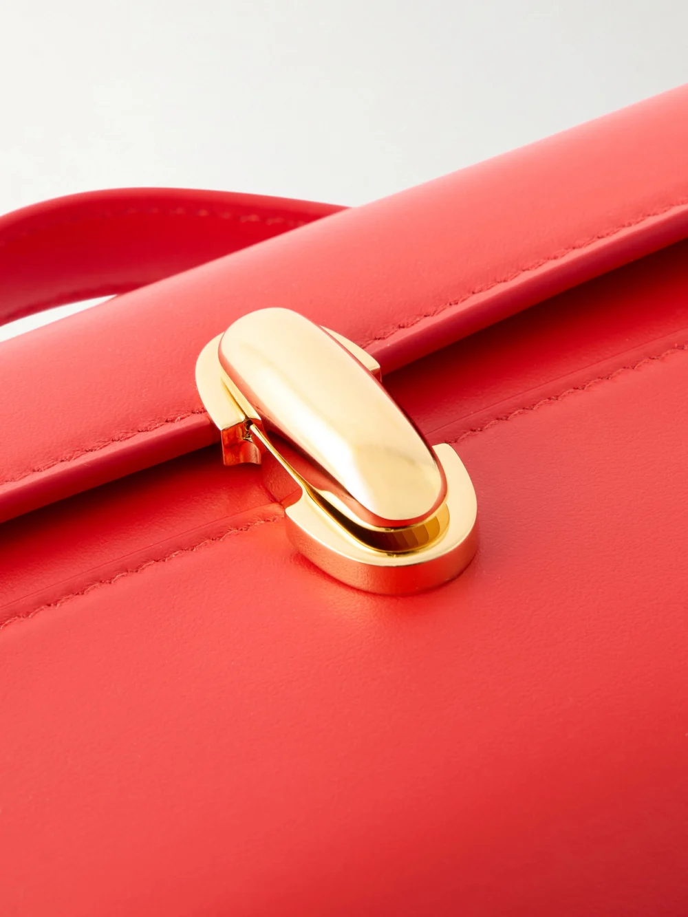 Close-up detail of the Savette Symmetry Pochette Leather Tote