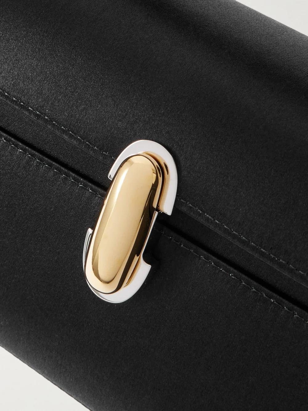 Close-up detail of the Savette Symmetry Pochette Satin Top-handle Bag