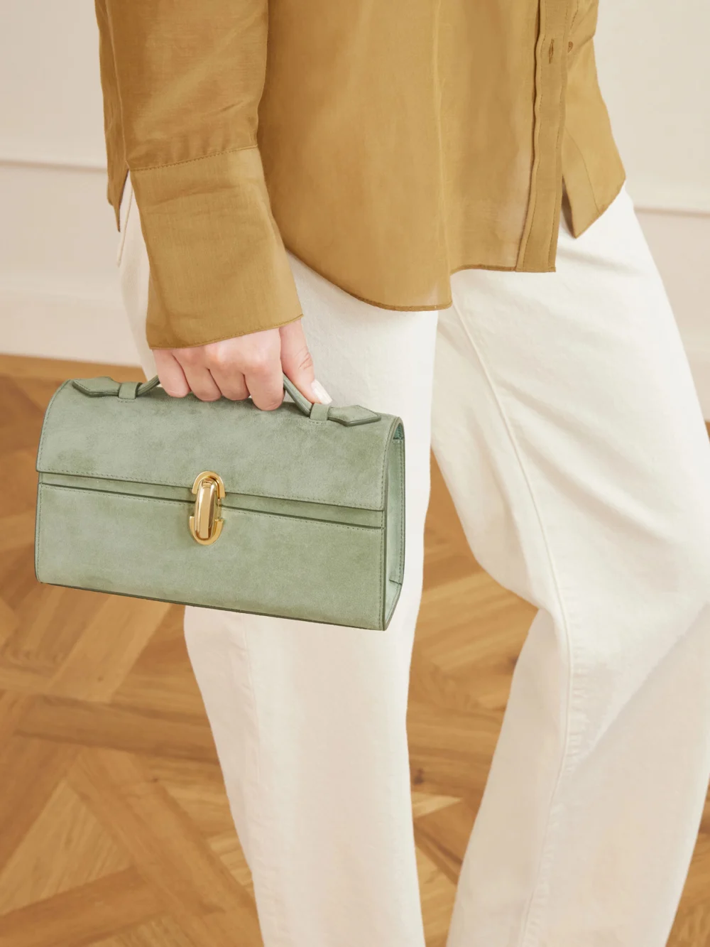 Savette Symmetry Pochette Suede Top-handle Bag, styled view