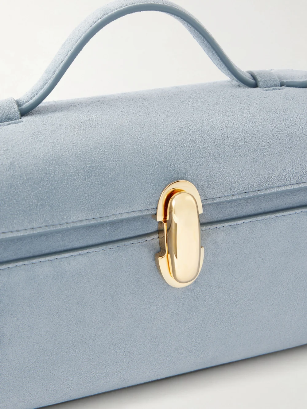 Close-up detail of the Savette Symmetry Pochette Suede Tote