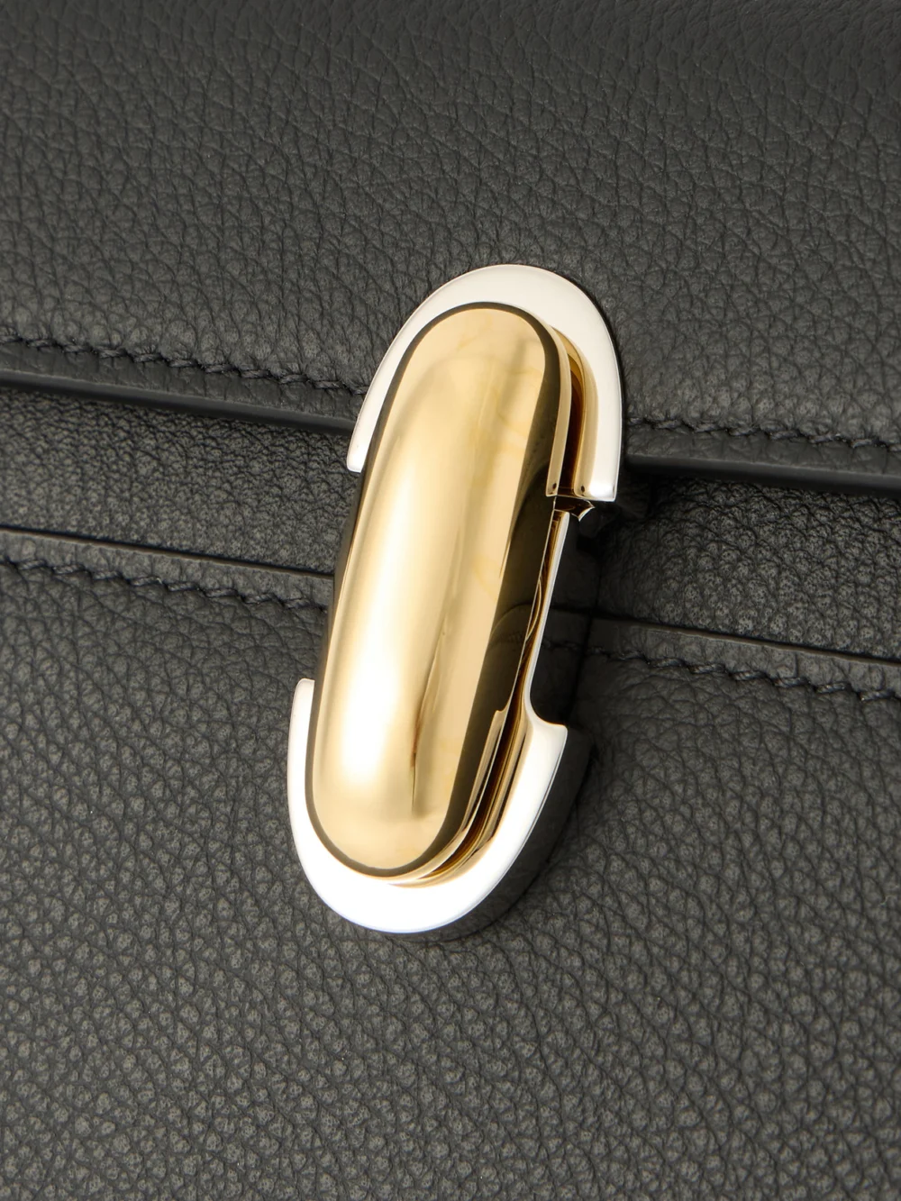 Close-up detail of the Savette Symmetry Textured-leather Shoulder Bag
