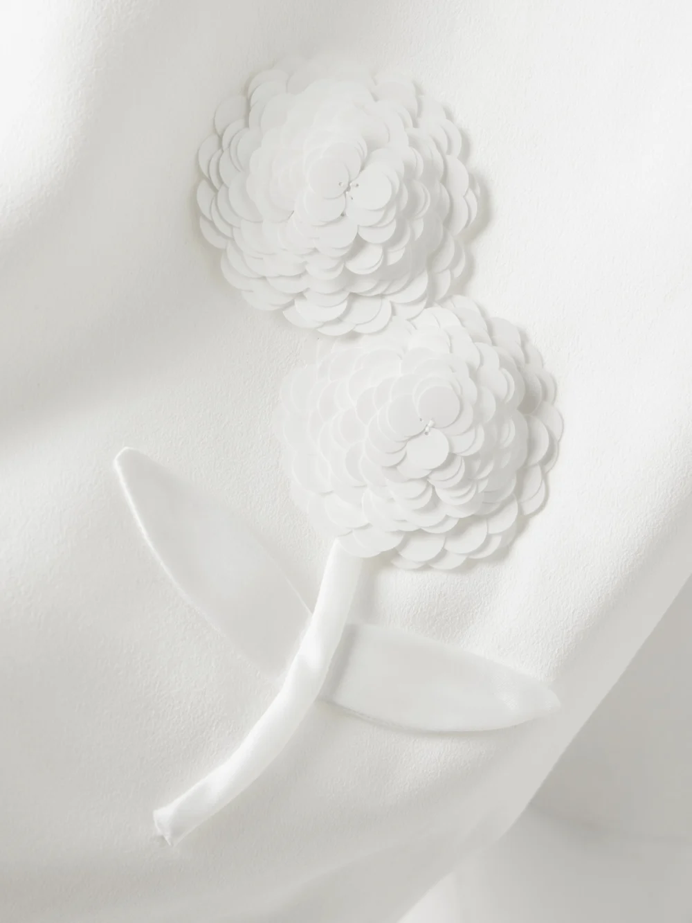 Close-up detail of the Self-Portrait Appliquéd Embellished Crepe Mini Dress