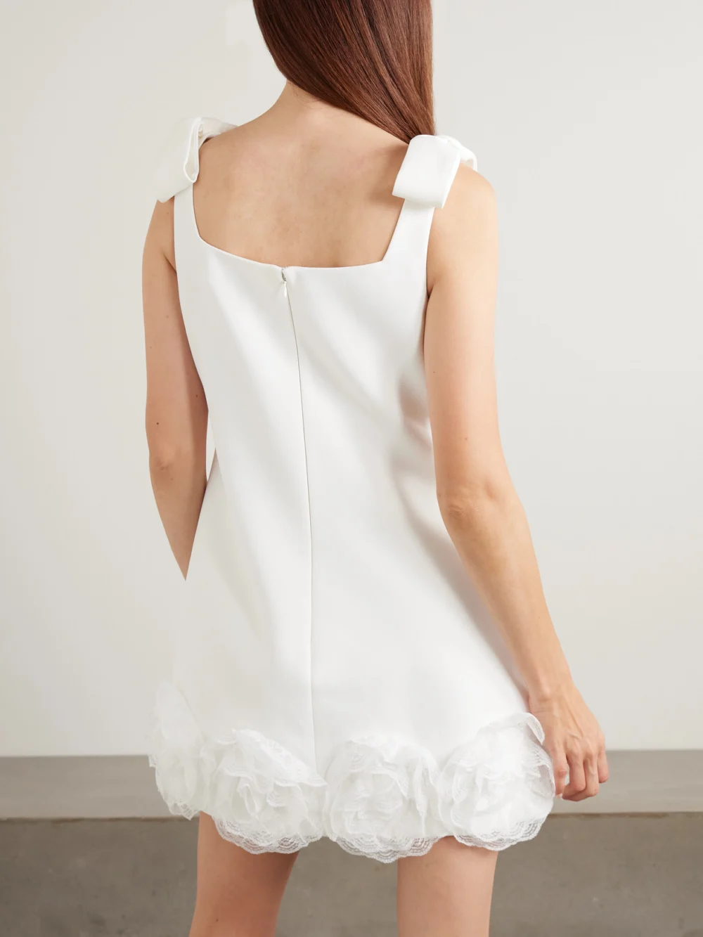 Back view of the Self-Portrait Bow-detailed Lace-trimmed Crepe Mini Dress