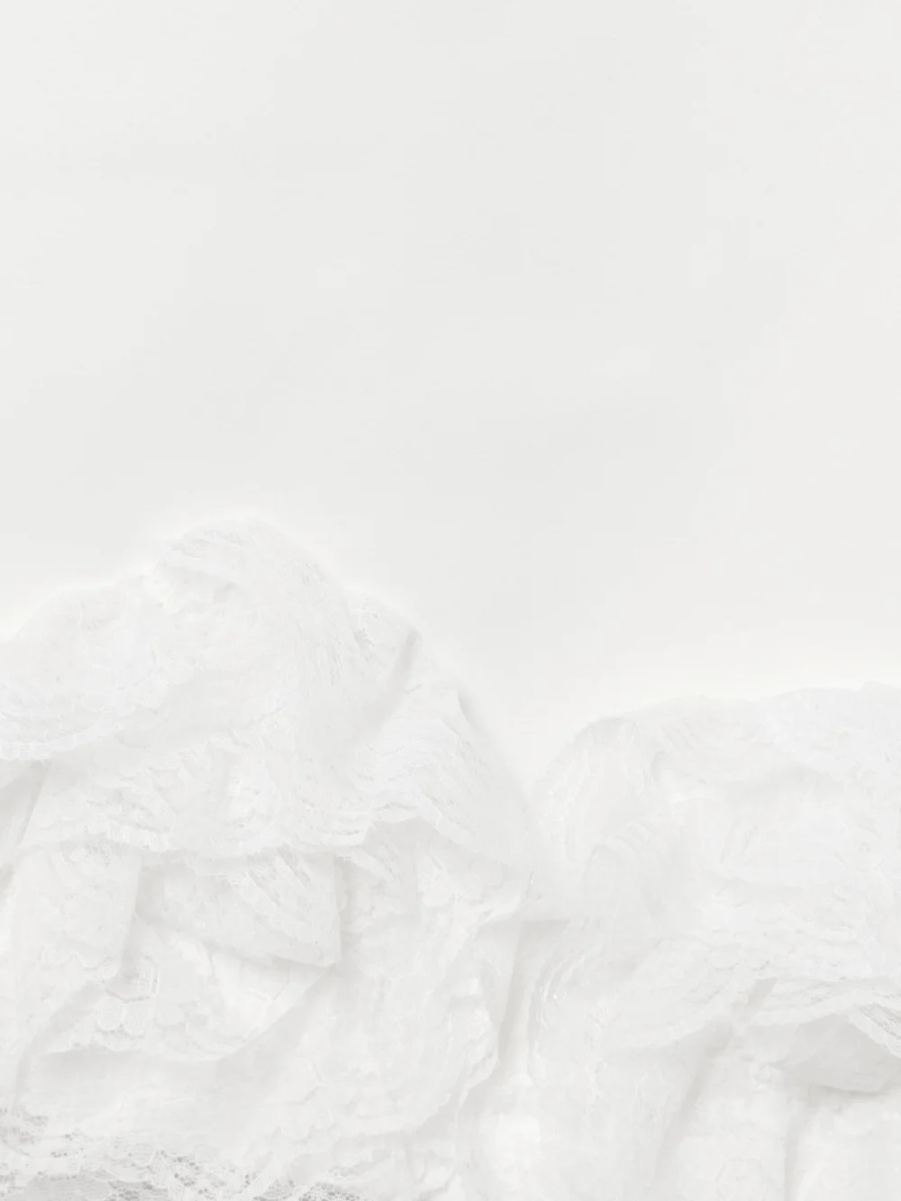 Close-up detail of the Self-Portrait Bow-detailed Lace-trimmed Crepe Mini Dress