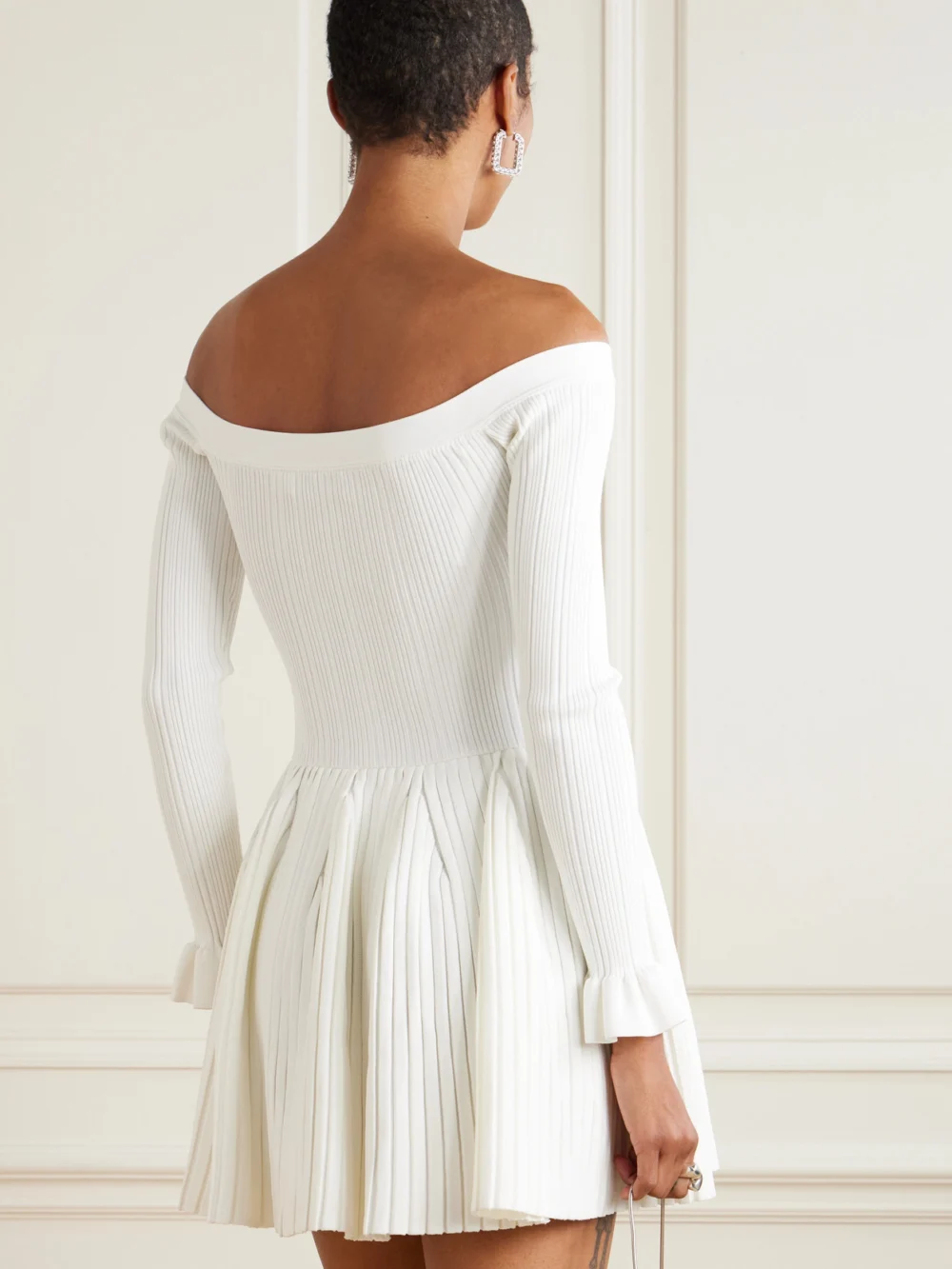 Back view of the Self-Portrait Off-the-shoulder Pleated Ribbed-knit Mini Dress