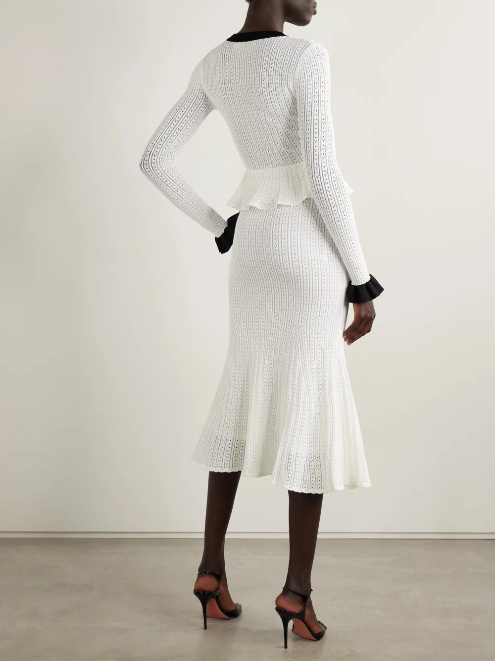 Back view of the Self-Portrait Pointelle-knit Peplum Midi Dress