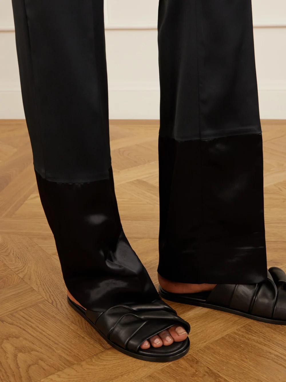 Close-up detail of the Sharon Wauchob Sue Paneled Satin Straight-leg Pants