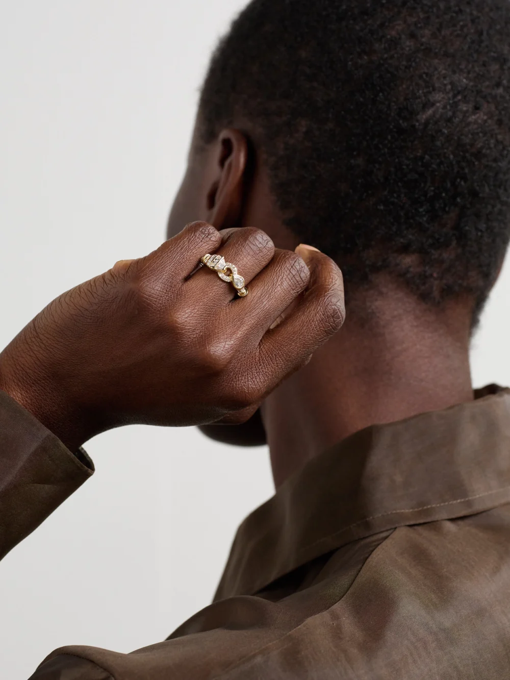 Shay Serpentine 18-karat Gold, Diamond and Garnet Ring, styled view