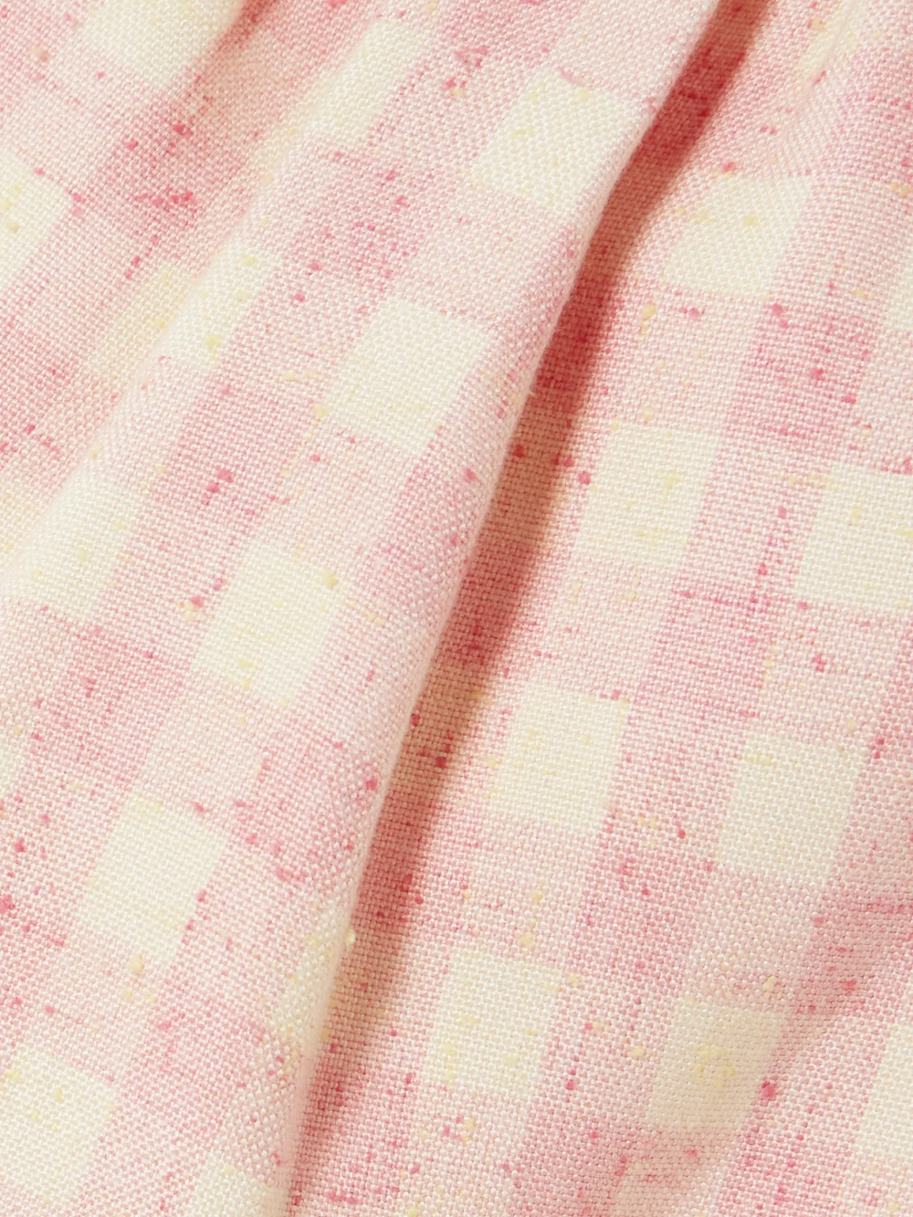 Close-up detail of the Shushu/Tong Bow-detailed Checked Tweed Mini Dress